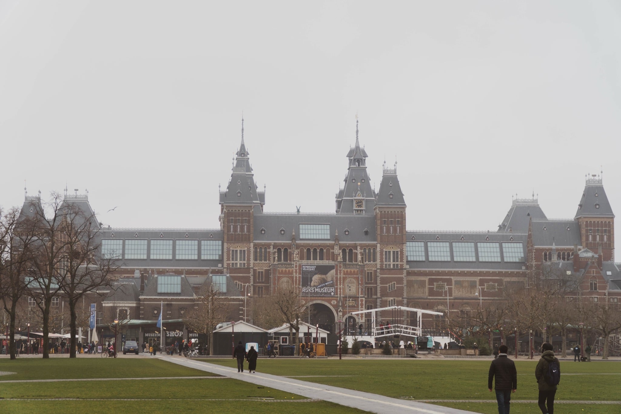 The Rijksmuseum rising across Museumplein on a misty grey winter day
